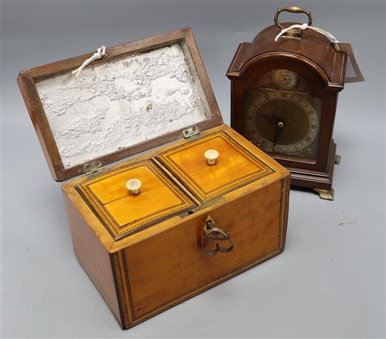 A George III satinwood tea caddy, width 19cm, and a mahogany mantel clock